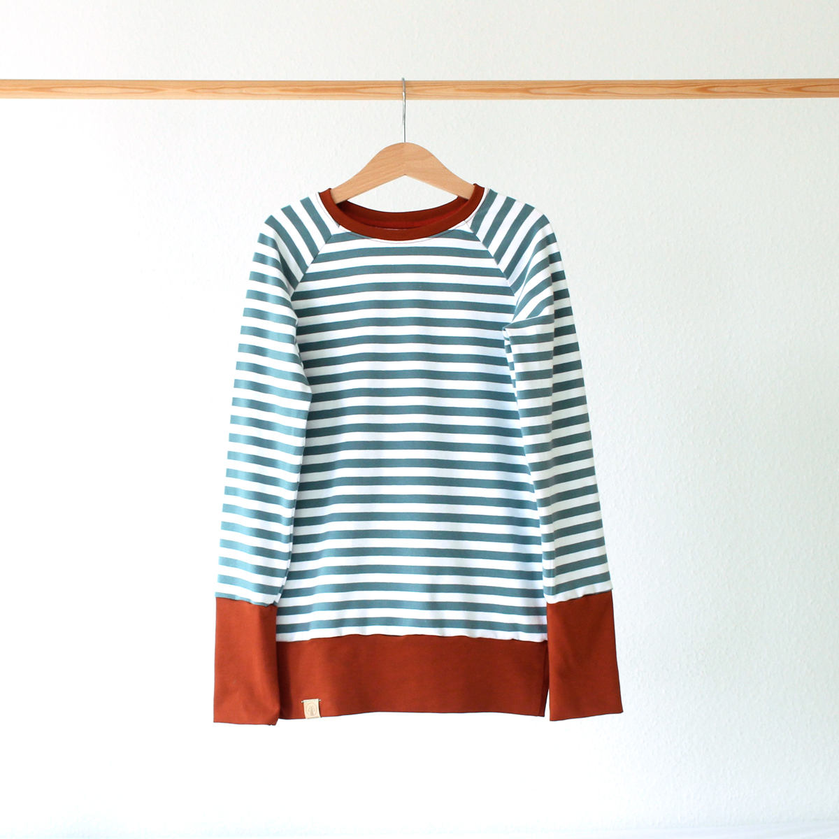 Wunschbrunnen Ringelpulli Petrol