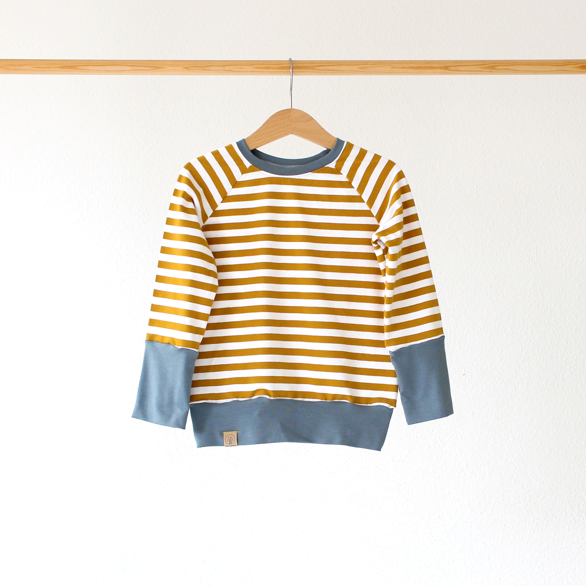 Wunschbrunnen Ringelpulli Senf